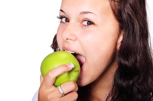 Young Woman Eating an Apple