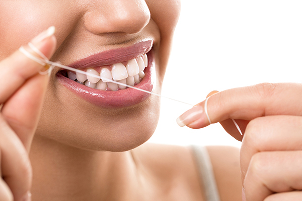 closeup the importance of flossing